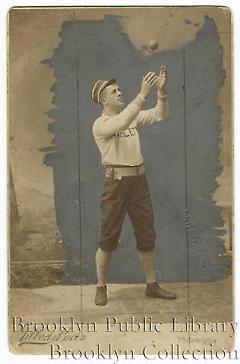 [Wilbert Robinson tossing ball]